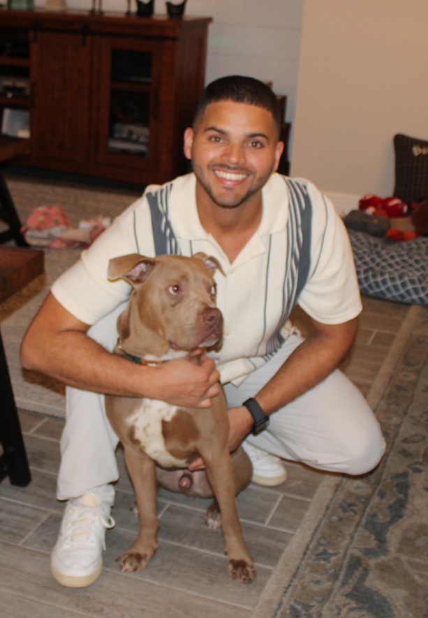Cesar Peña, founder of Pawground, with his pit mix Jacob
